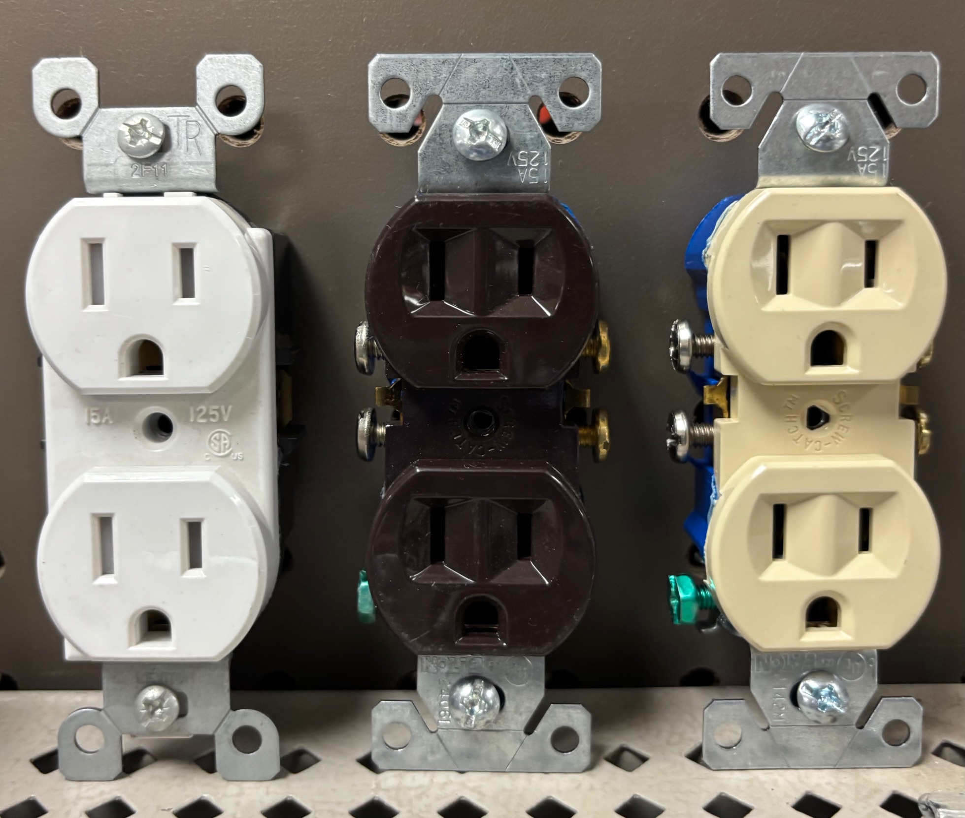 Three colors of electrical outlets